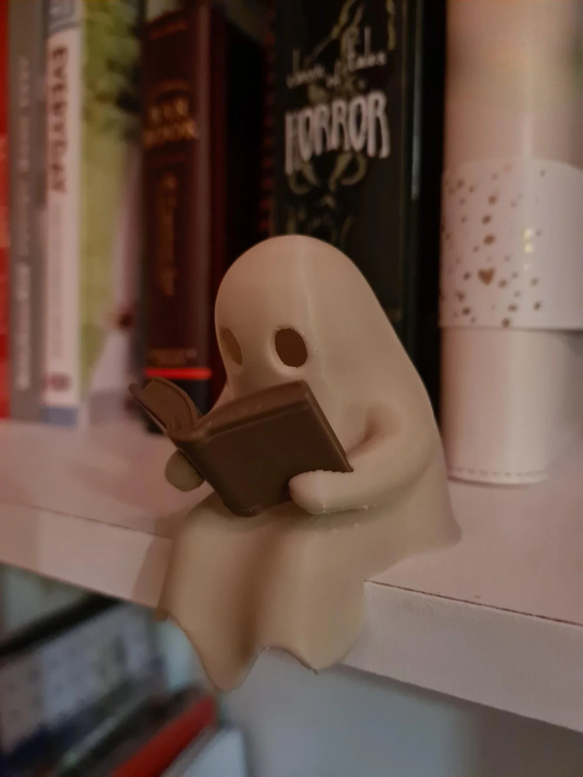 Reading Ghost Shelf-Sitter with Flickering Light